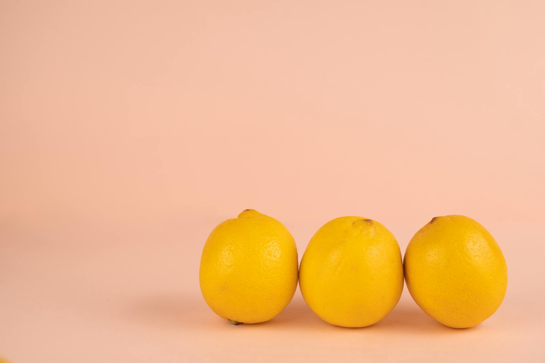 Yellow silicone vibrator surrounded by peeled bananas on a soft yellow background